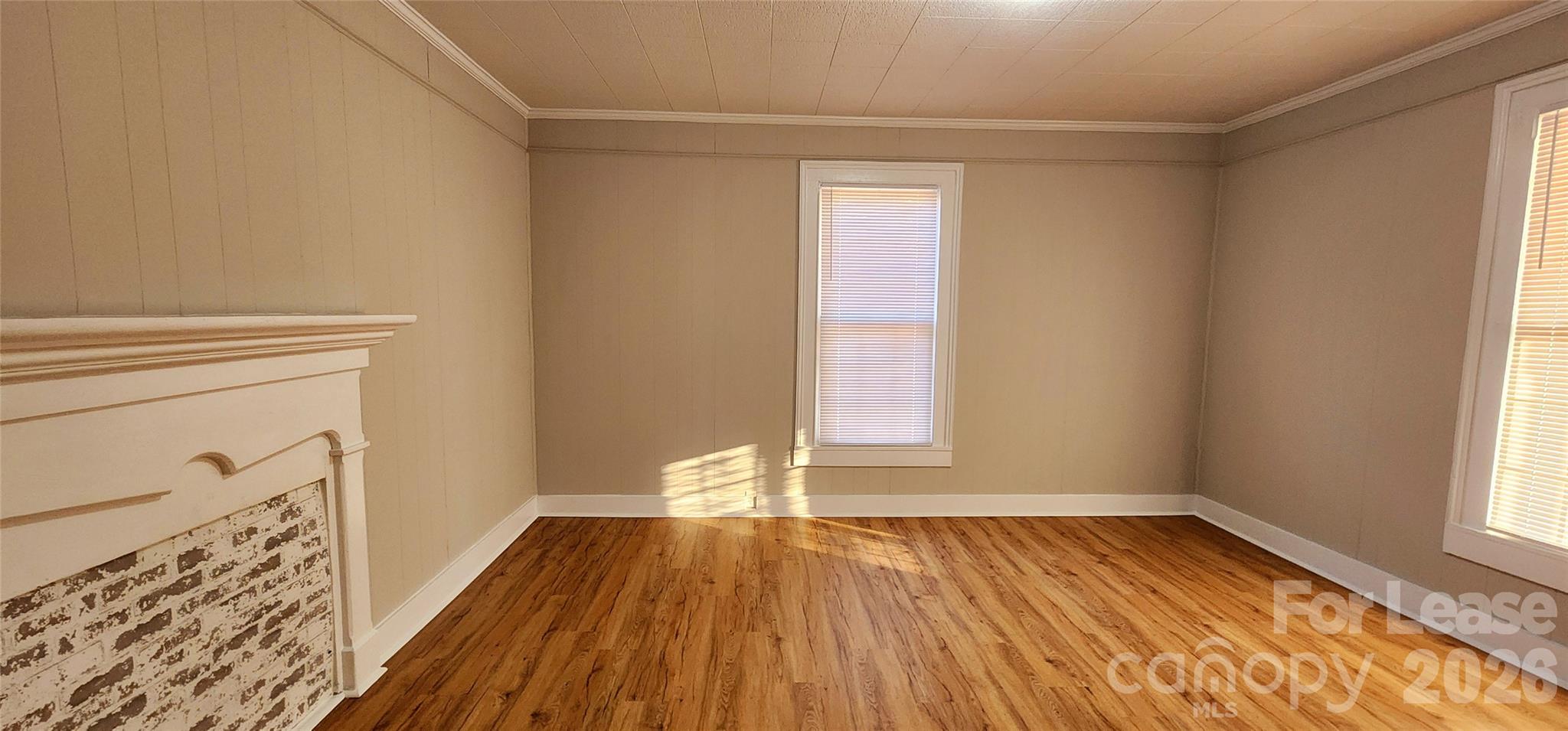 359 Flat Rock Road Lawndale, NC 28090 - Photo 5 of 19 a view of empty room with wooden floor and fan