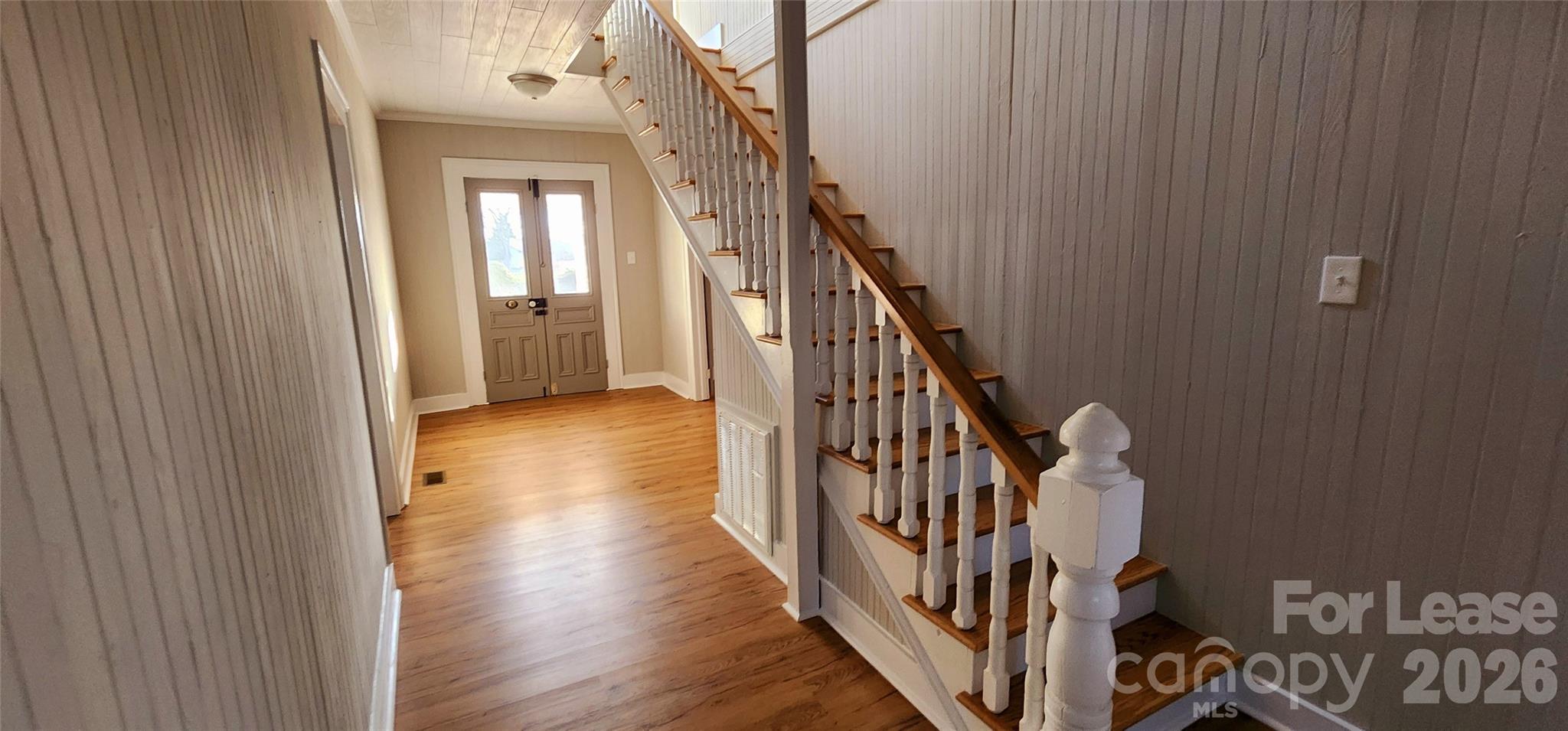 359 Flat Rock Road Lawndale, NC 28090 - Photo 7 of 19 a view of a hallway with wooden floor and staircase