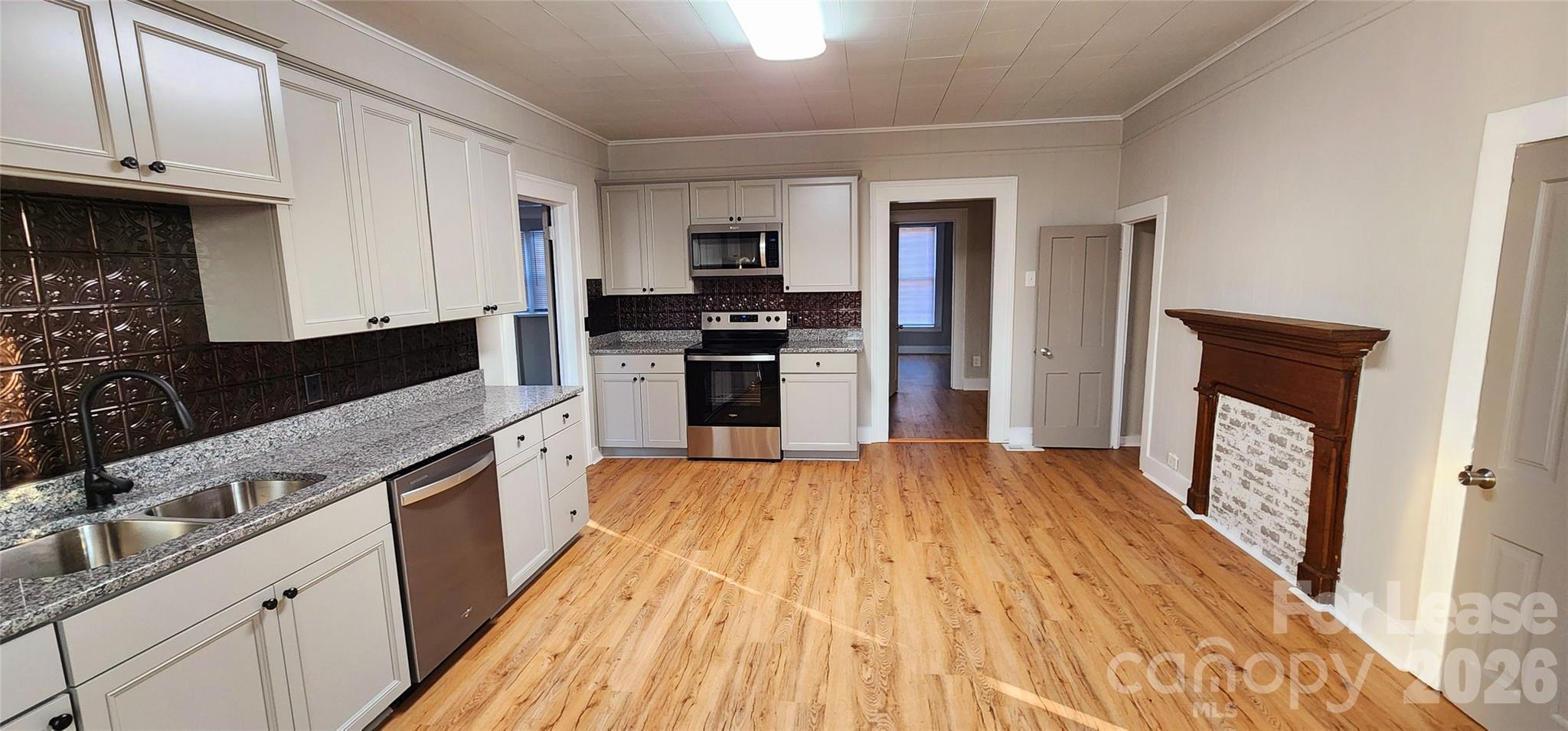 359 Flat Rock Road Lawndale, NC 28090 - Photo 8 of 19 a kitchen with granite countertop a refrigerator stove and sink