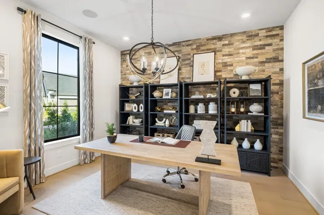 a room with table chairs and window