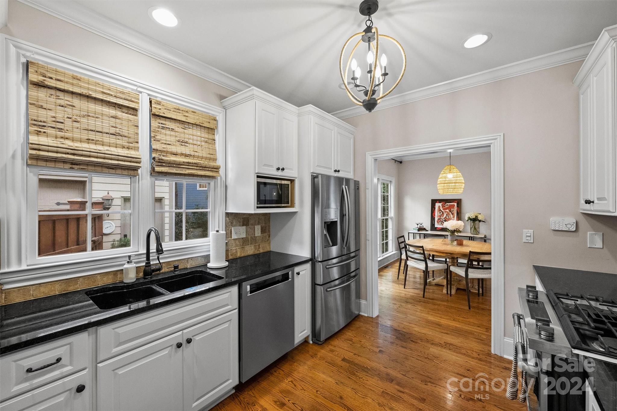 813 Millbrook Road Charlotte, NC 28211 - Photo 17 of 47 a kitchen with granite countertop stainless steel appliances a sink and counter space