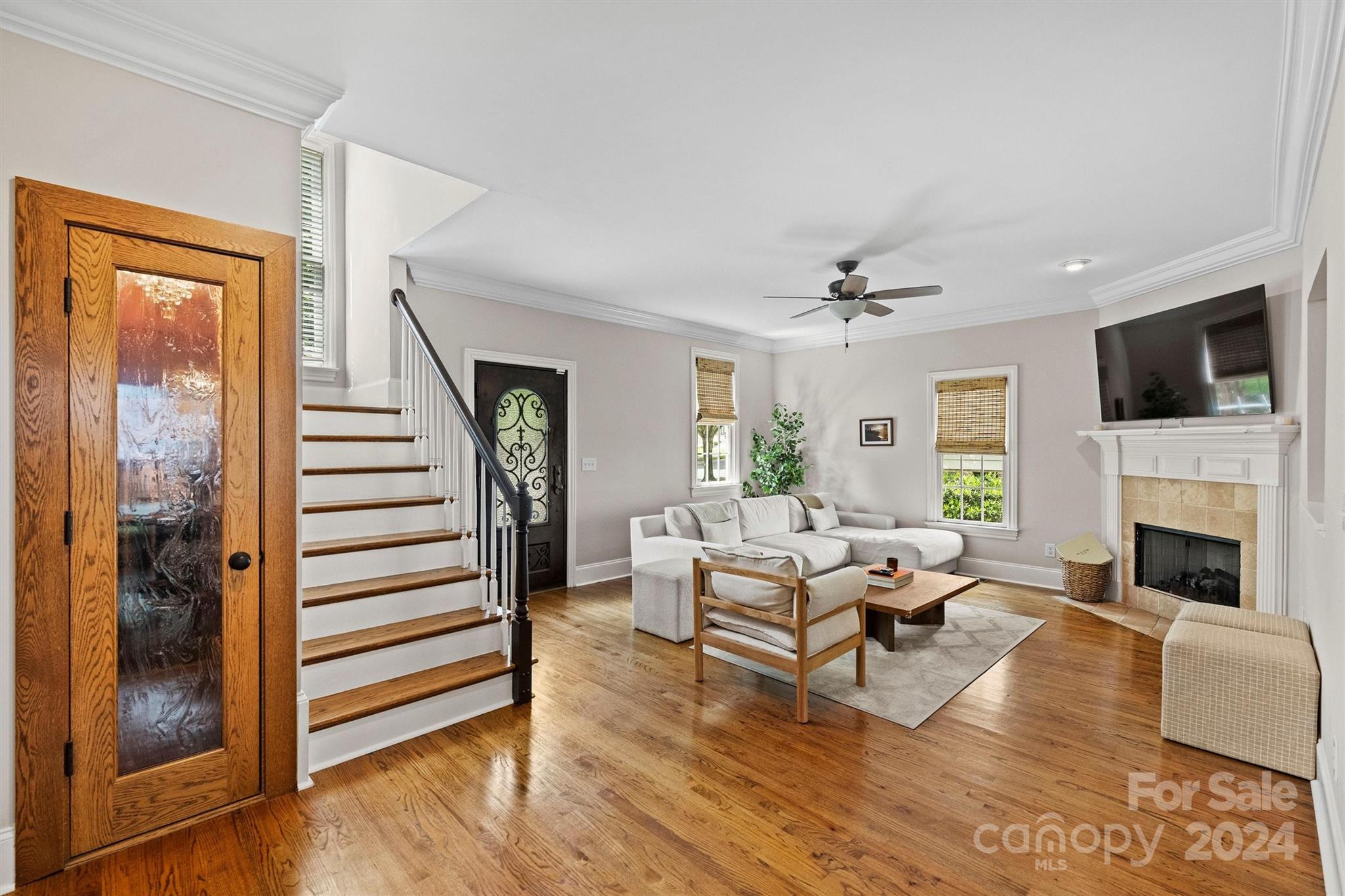 813 Millbrook Road Charlotte, NC 28211 - Photo 2 of 47 a living room with furniture a fireplace and a flat screen tv