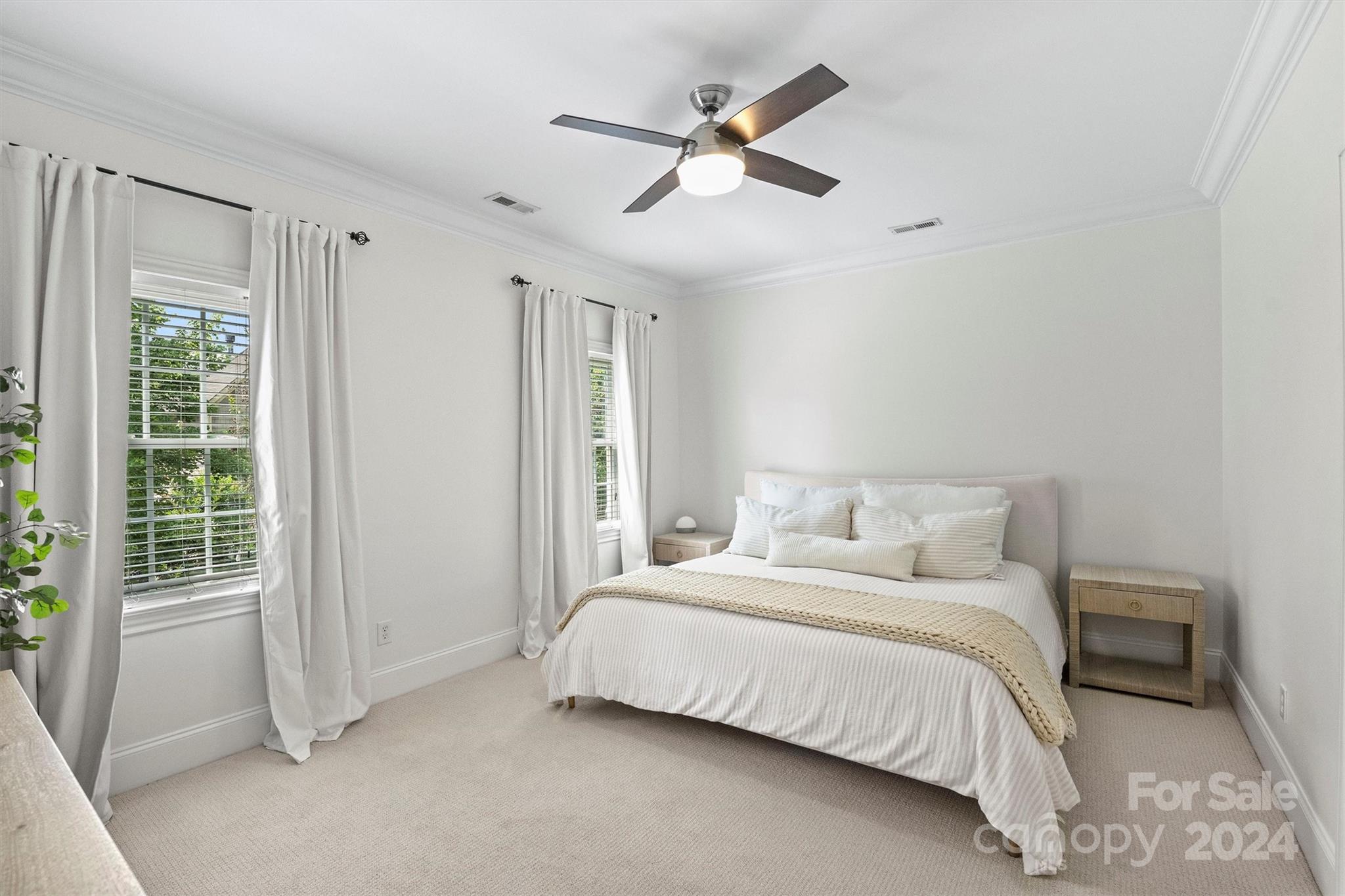 813 Millbrook Road Charlotte, NC 28211 - Photo 22 of 47 a bedroom with a bed and a large window