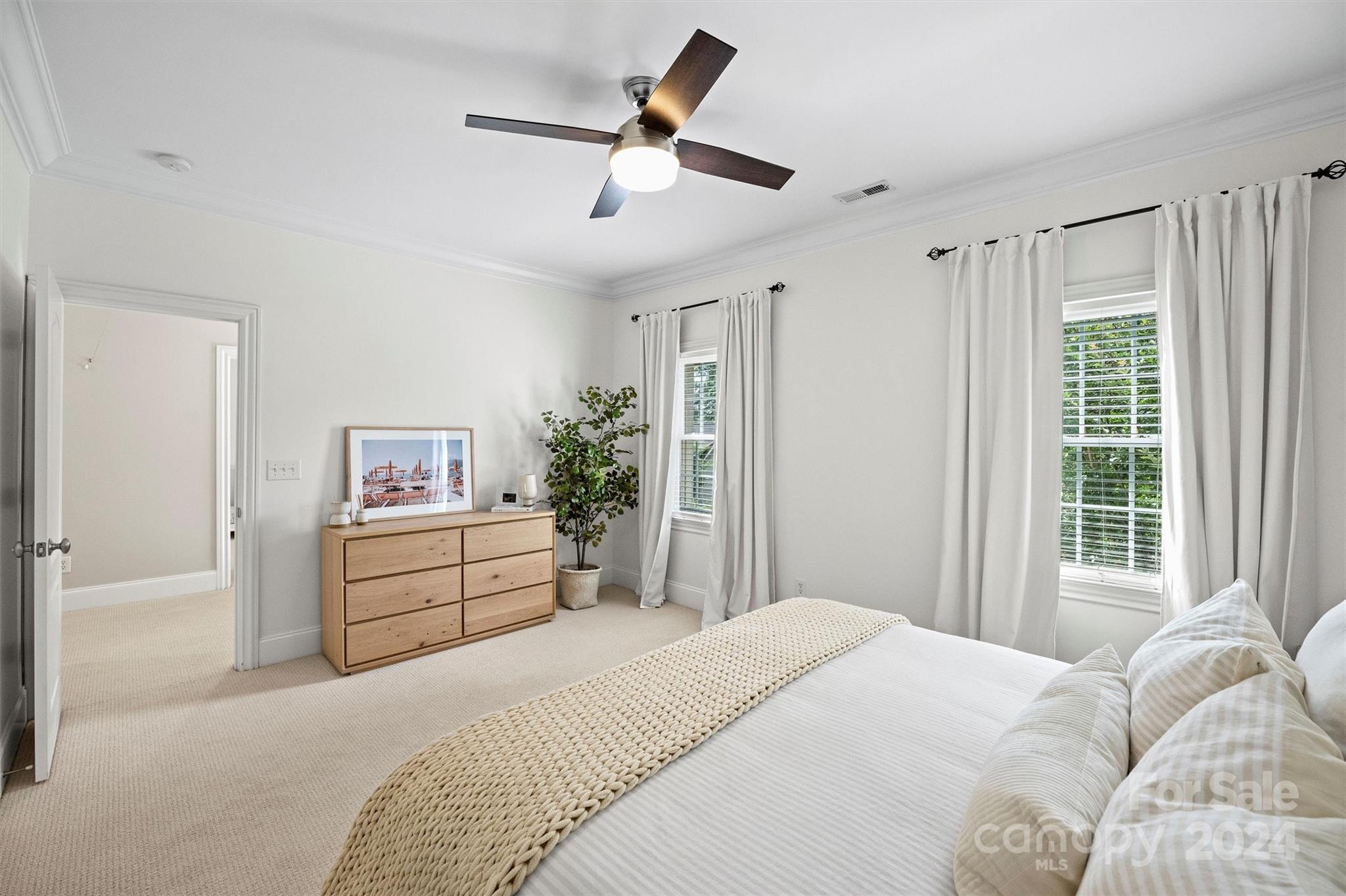 813 Millbrook Road Charlotte, NC 28211 - Photo 24 of 47 a bedroom with a bed dresser and a window