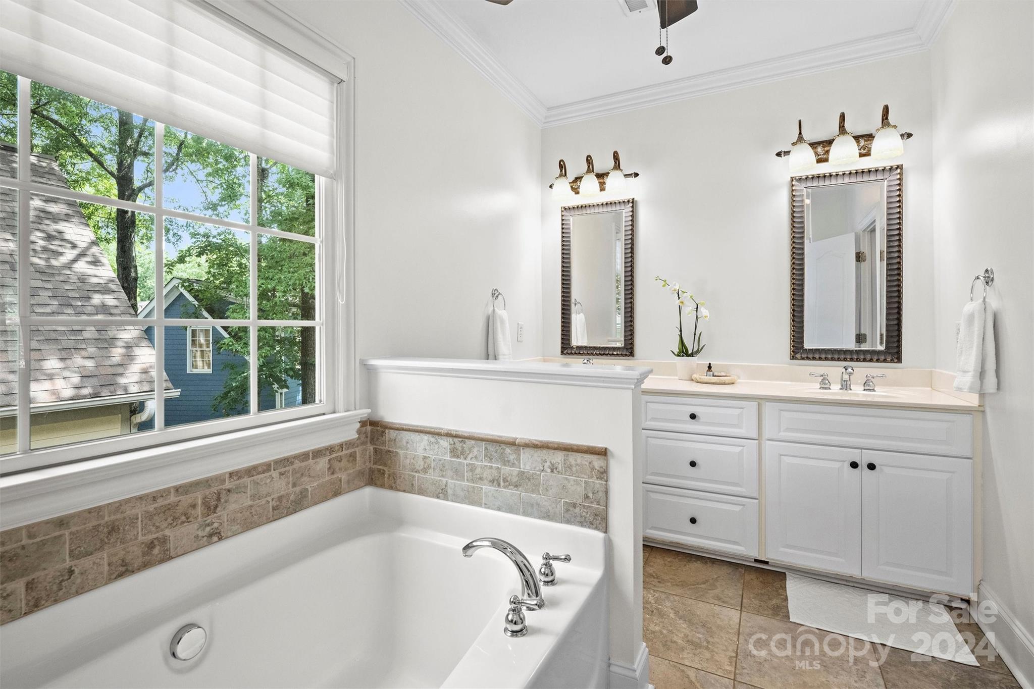 813 Millbrook Road Charlotte, NC 28211 - Photo 26 of 47 a bathroom with a bathtub and a sink