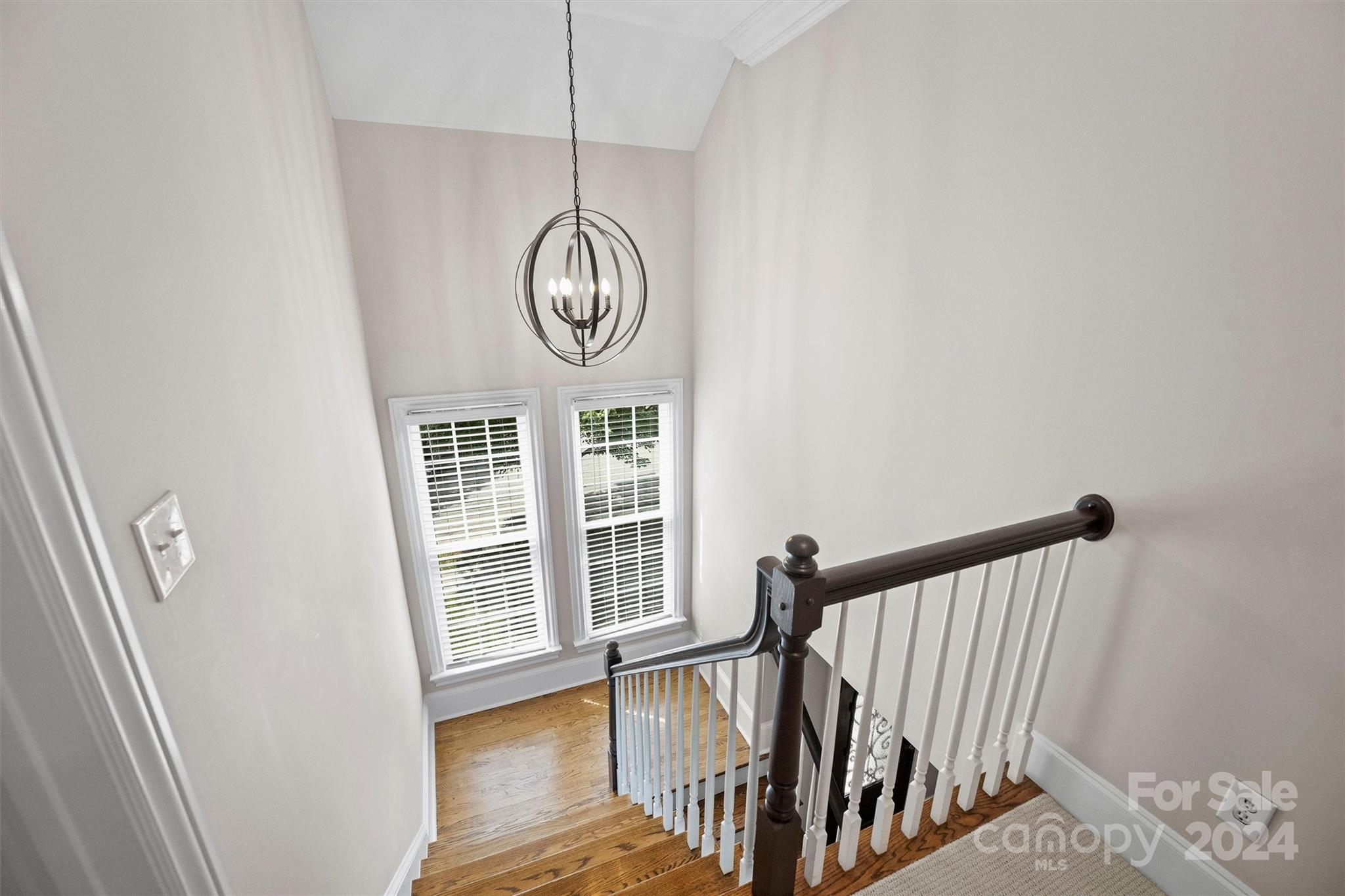813 Millbrook Road Charlotte, NC 28211 - Photo 29 of 47 a view of staircase with wooden floor and window