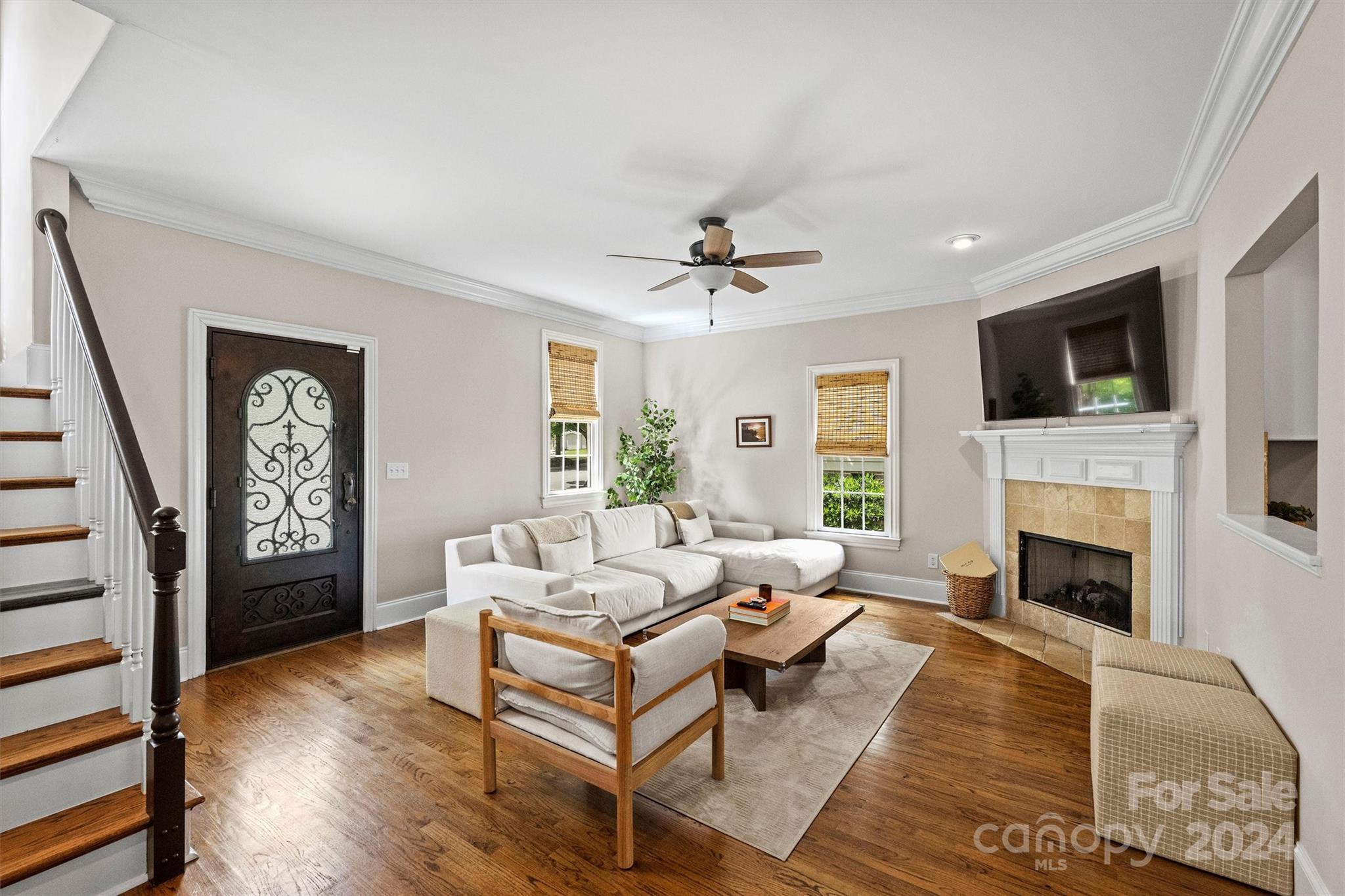 813 Millbrook Road Charlotte, NC 28211 - Photo 3 of 47 a living room with furniture fireplace and a flat screen tv