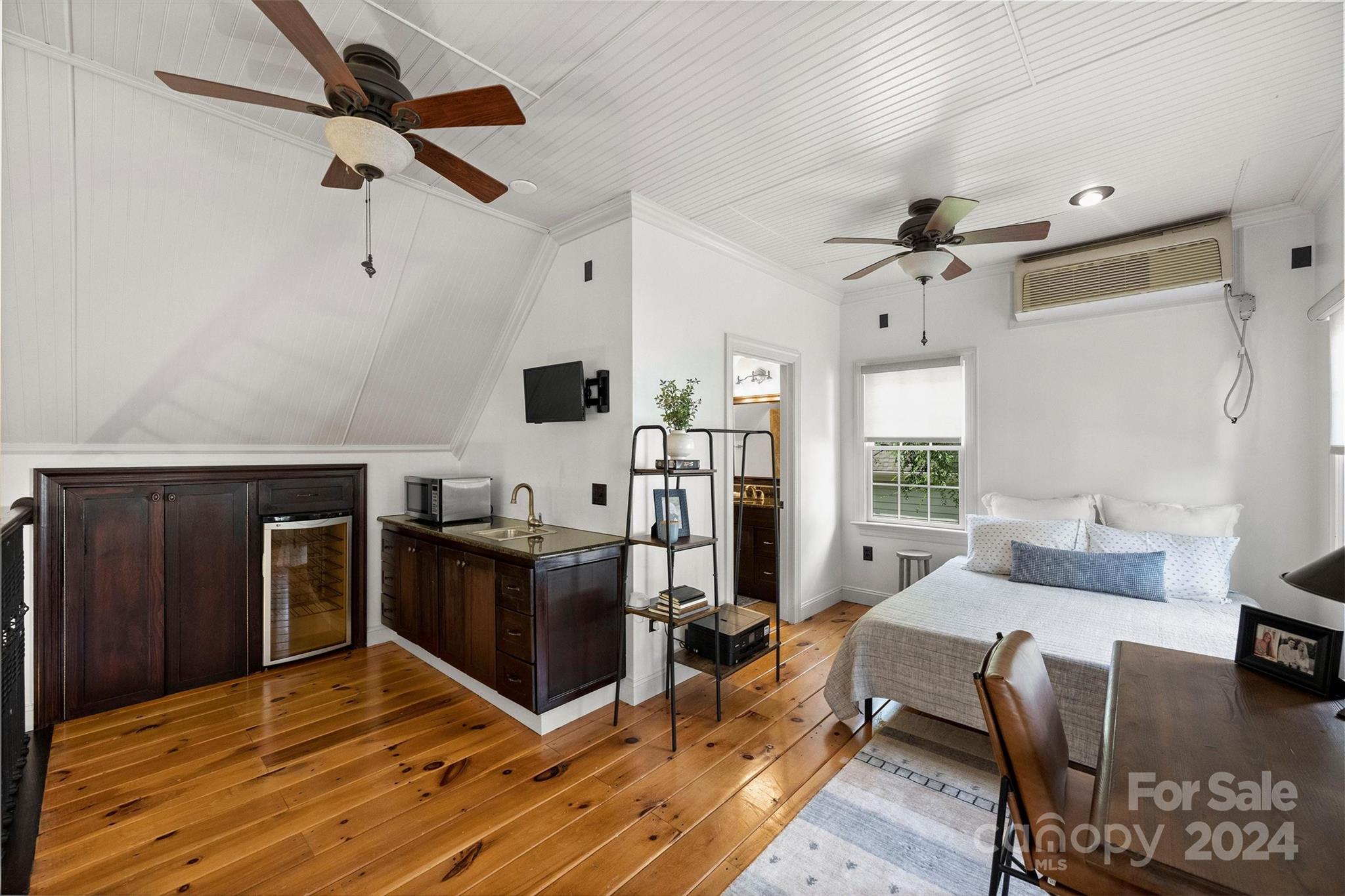 813 Millbrook Road Charlotte, NC 28211 - Photo 31 of 47 a living room with couches and kitchen view with wooden floor