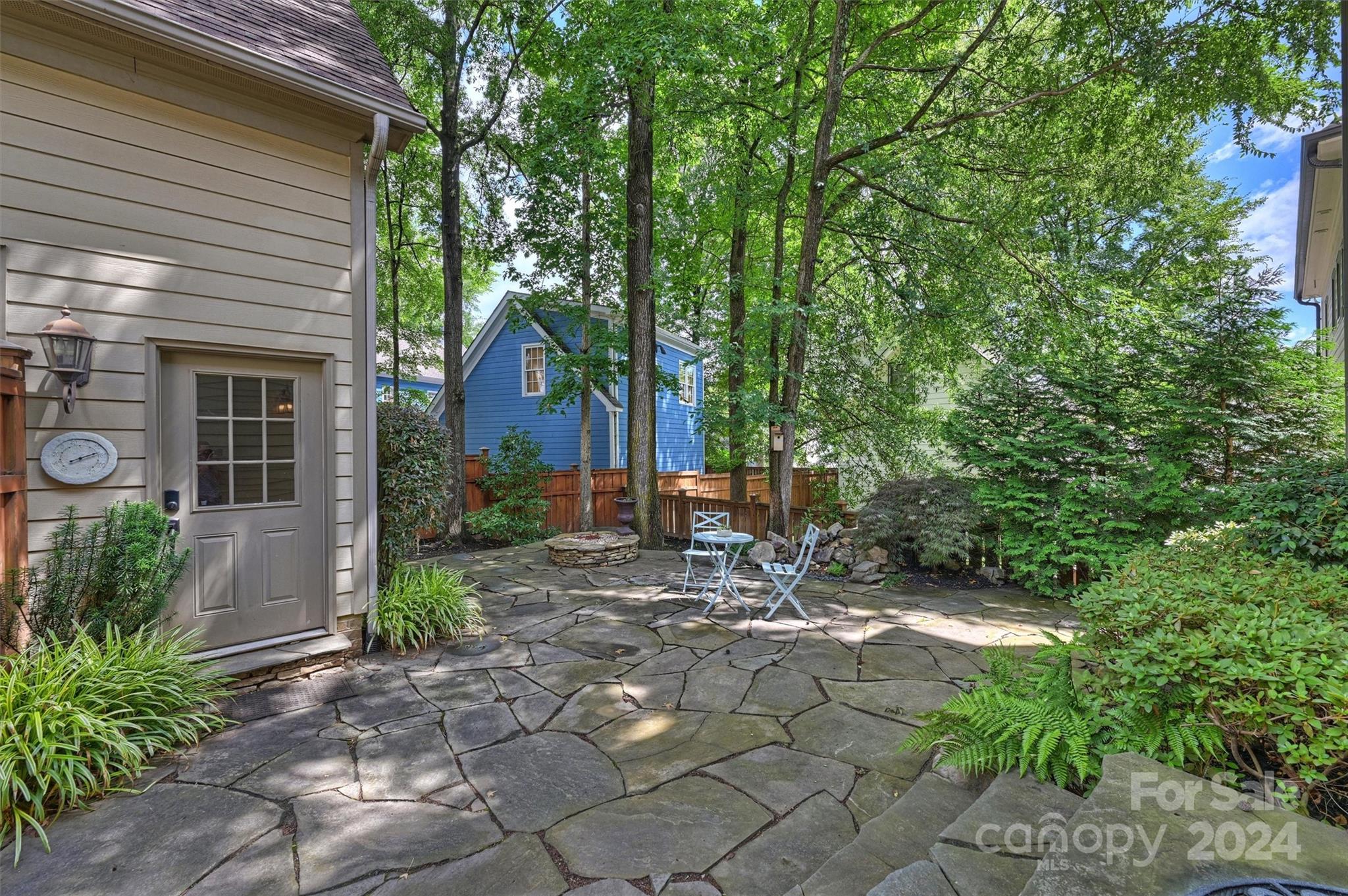 813 Millbrook Road Charlotte, NC 28211 - Photo 32 of 47 a view of a house with backyard and garden