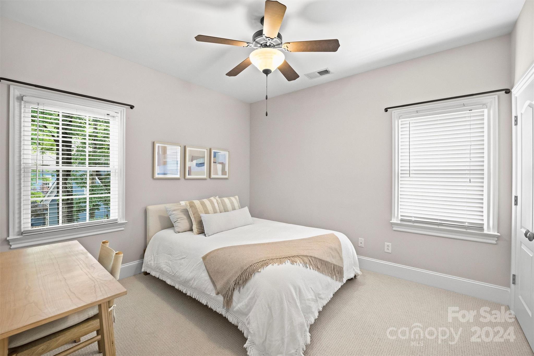 813 Millbrook Road Charlotte, NC 28211 - Photo 37 of 47 a bedroom with a large bed and a window