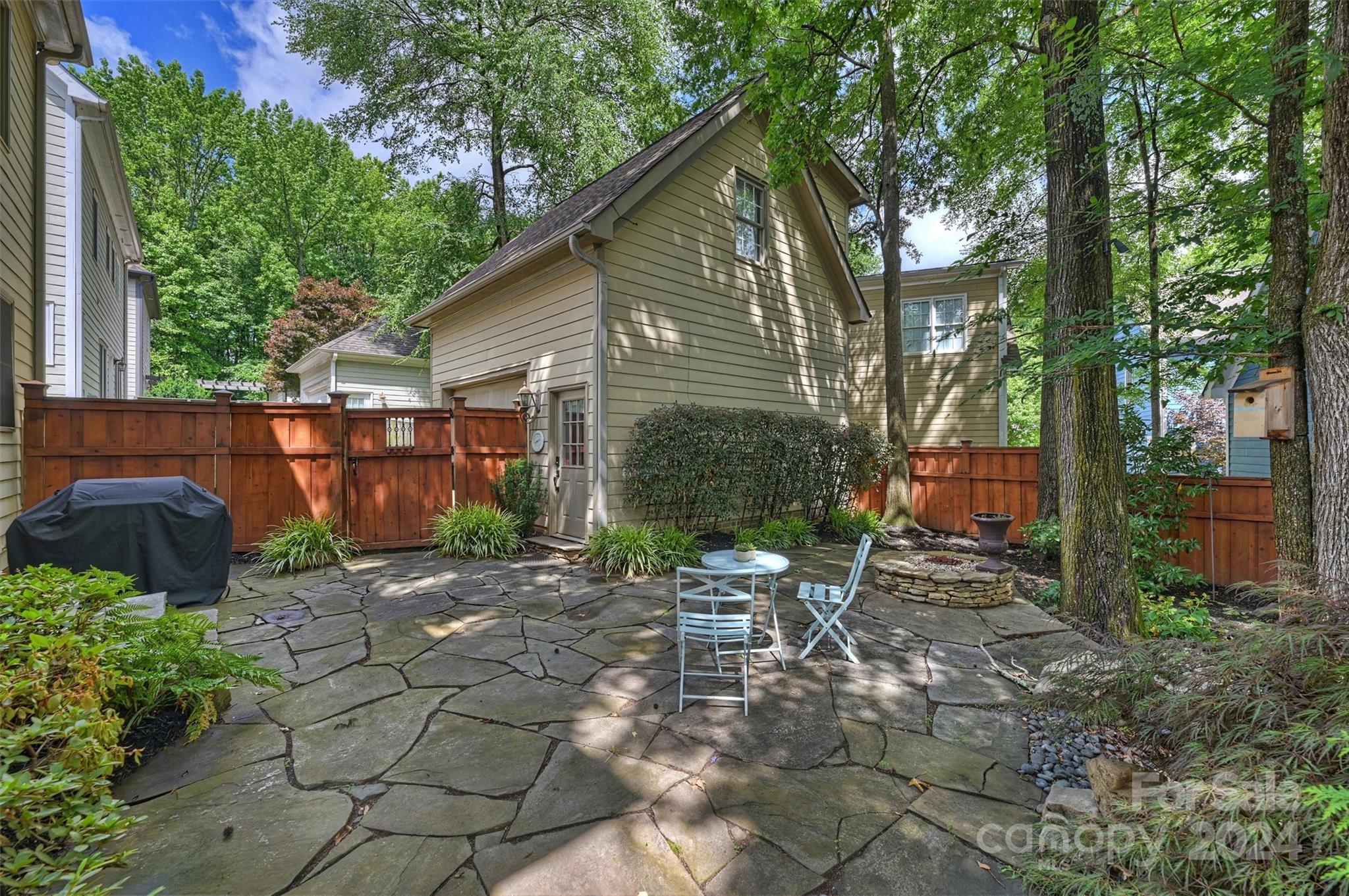 813 Millbrook Road Charlotte, NC 28211 - Photo 41 of 47 a view of backyard with outdoor seating and trees