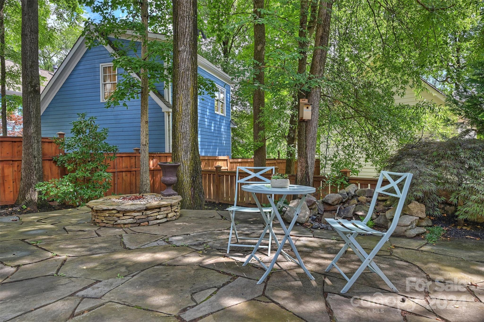 813 Millbrook Road Charlotte, NC 28211 - Photo 45 of 47 a view of a patio with table and chairs and potted plants