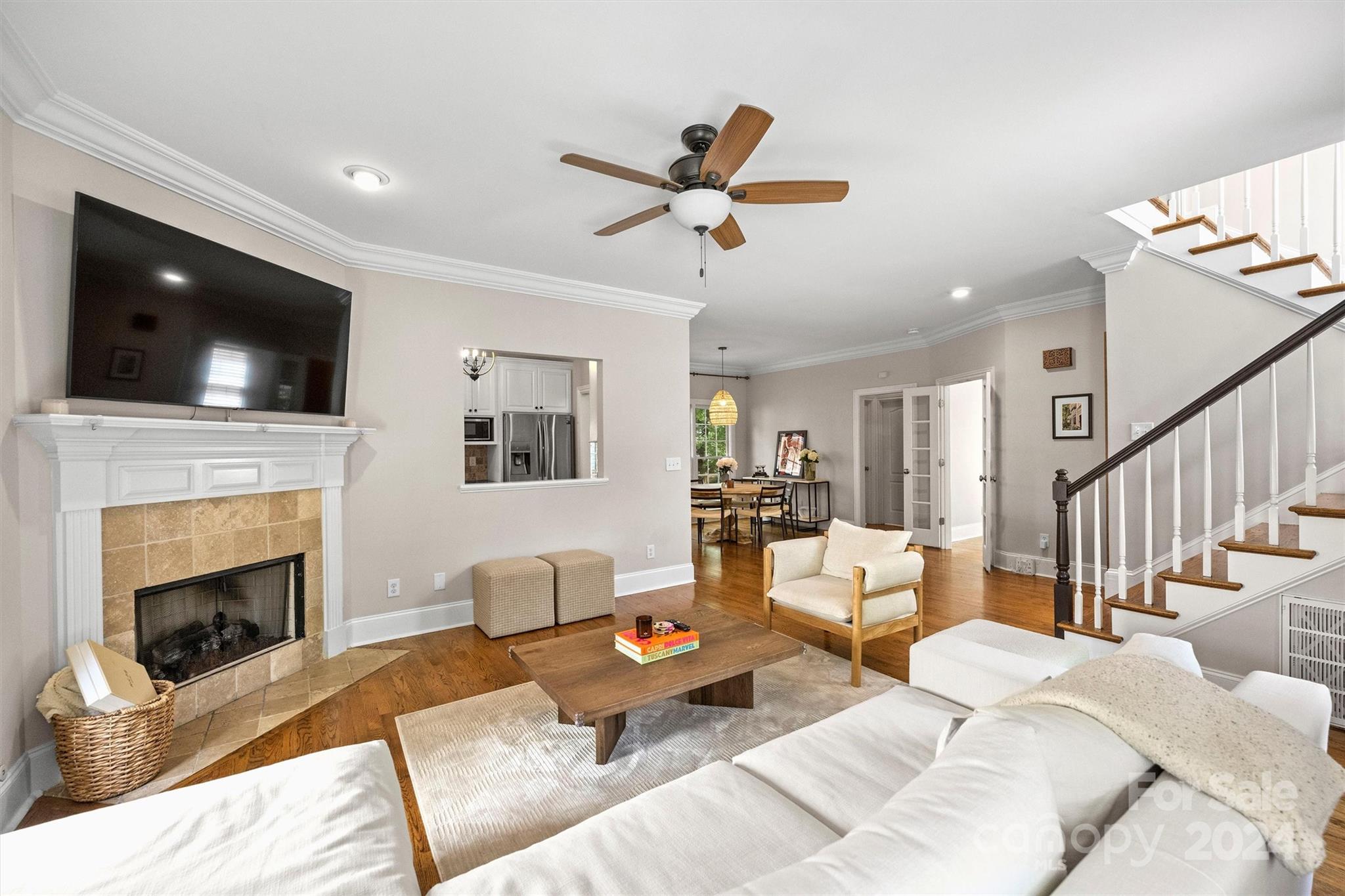 813 Millbrook Road Charlotte, NC 28211 - Photo 9 of 47 a living room with furniture a flat screen tv and a fireplace