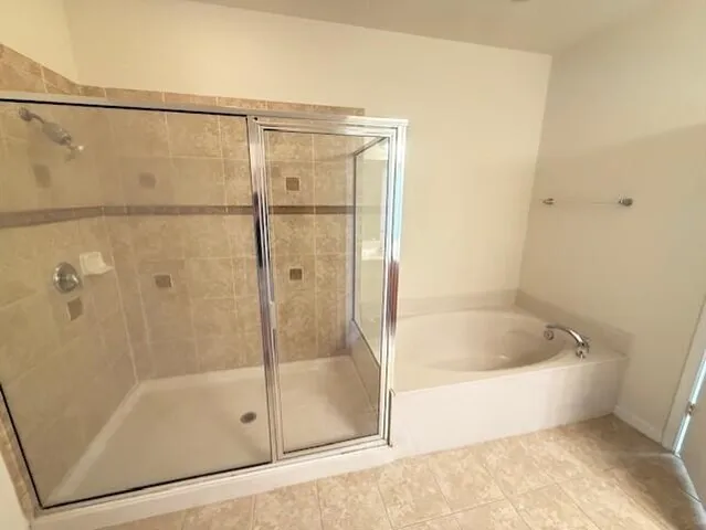 a bath tub sitting next to a shower