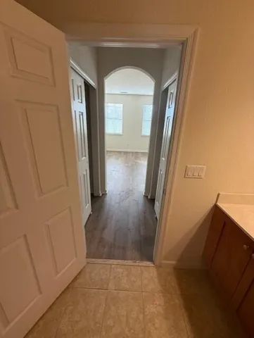 wooden floor in a hall with an entryway