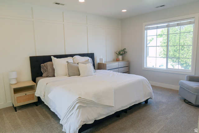 1204 North 3020th Street West Provo, UT 84601 - Photo 24 of 35 Primary bedroom featuring board and batten accent wall, recessed lighting, and carpet flooring