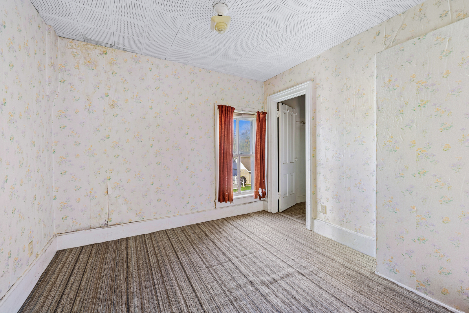 130 Seymour Street Sharon, WI 53585 - Photo 13 of 23 a view of an empty room with wooden floor and a window