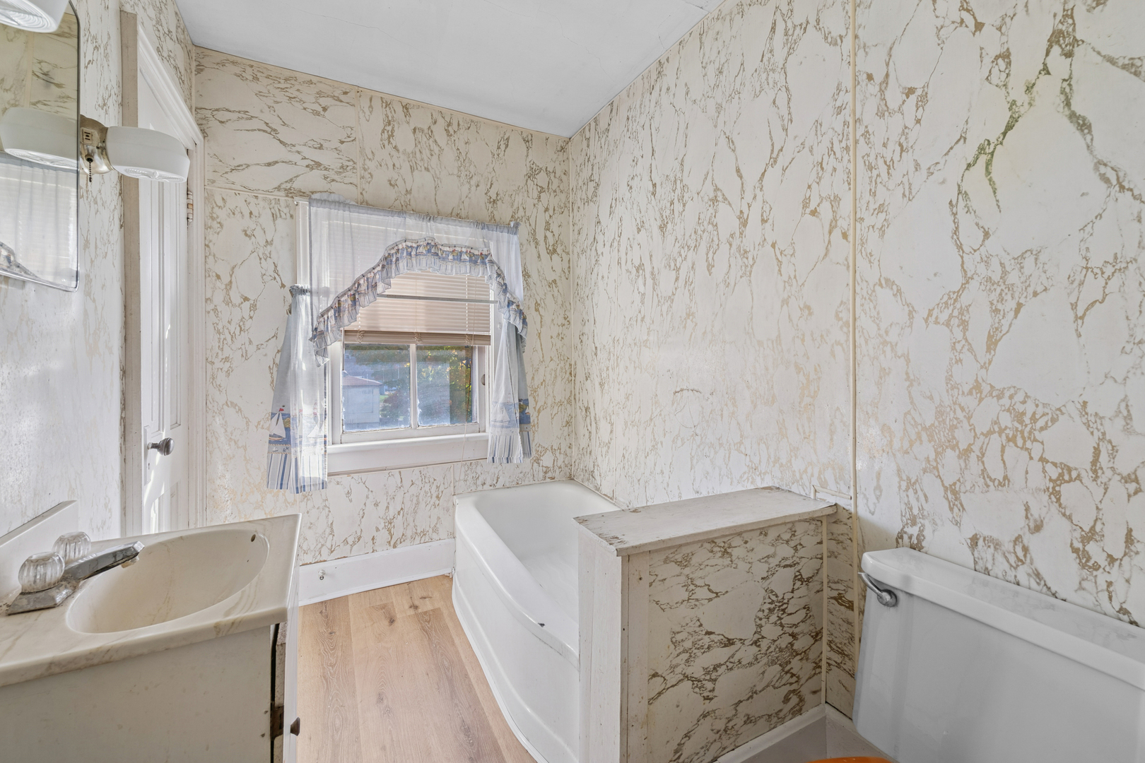 130 Seymour Street Sharon, WI 53585 - Photo 14 of 23 a bathroom with a tub sink and mirror