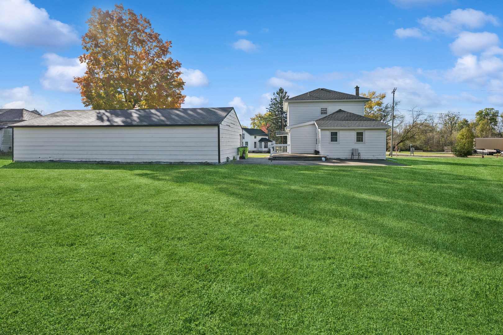130 Seymour Street Sharon, WI 53585 - Photo 17 of 23 a view of a house with a yard and large trees