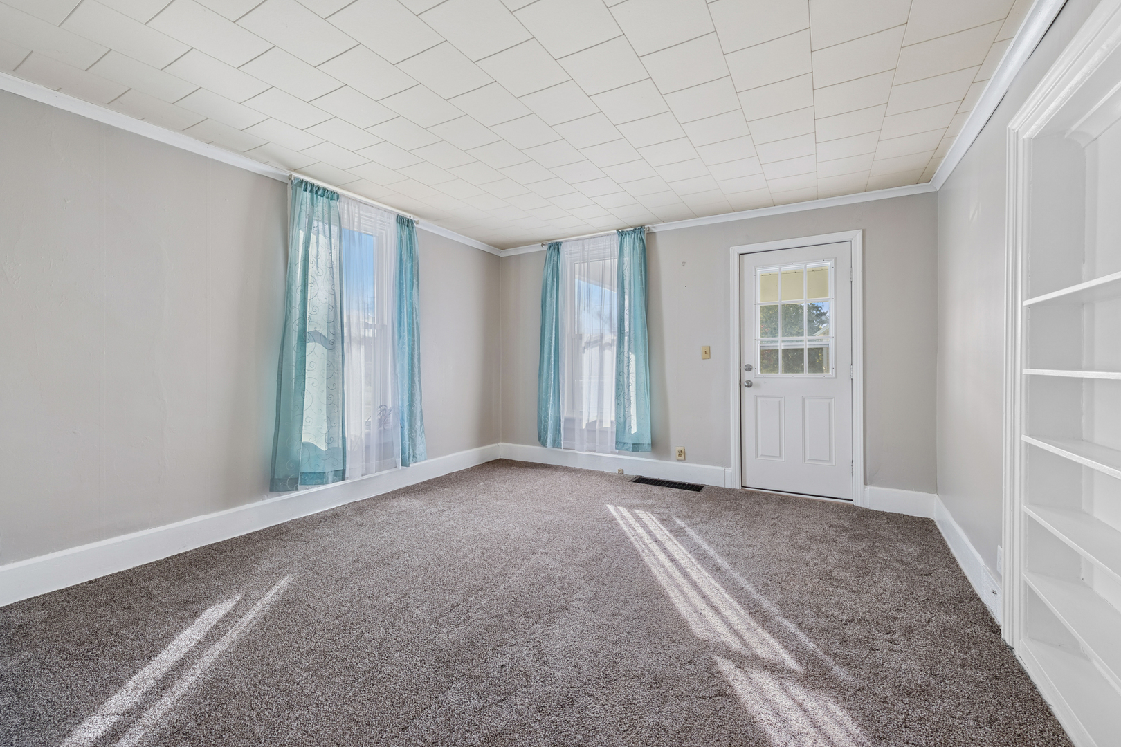 130 Seymour Street Sharon, WI 53585 - Photo 2 of 23 an empty room with windows