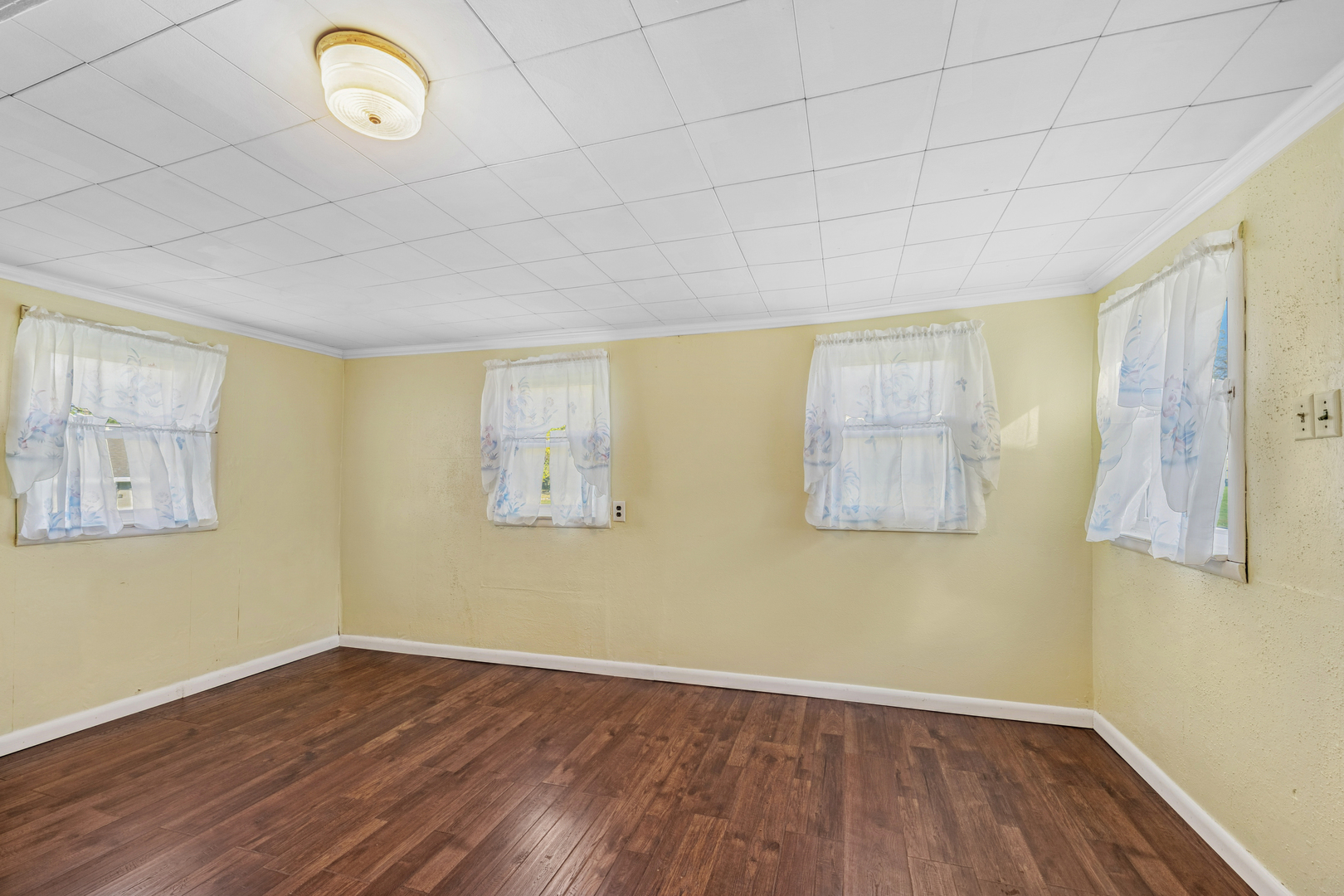 130 Seymour Street Sharon, WI 53585 - Photo 5 of 23 a view of a room with wooden floor and window