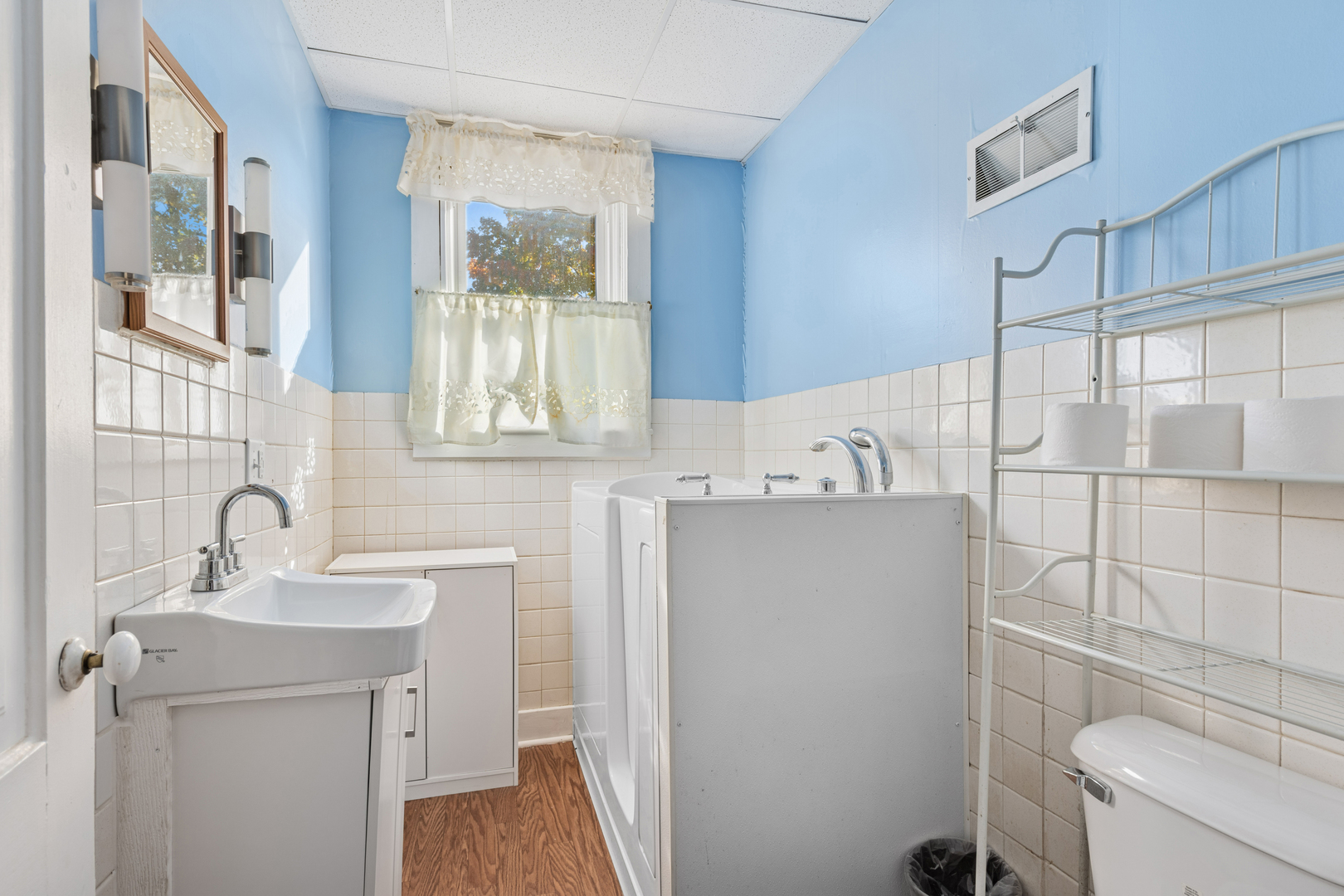 130 Seymour Street Sharon, WI 53585 - Photo 9 of 23 a bathroom with a sink a toilet and a mirror