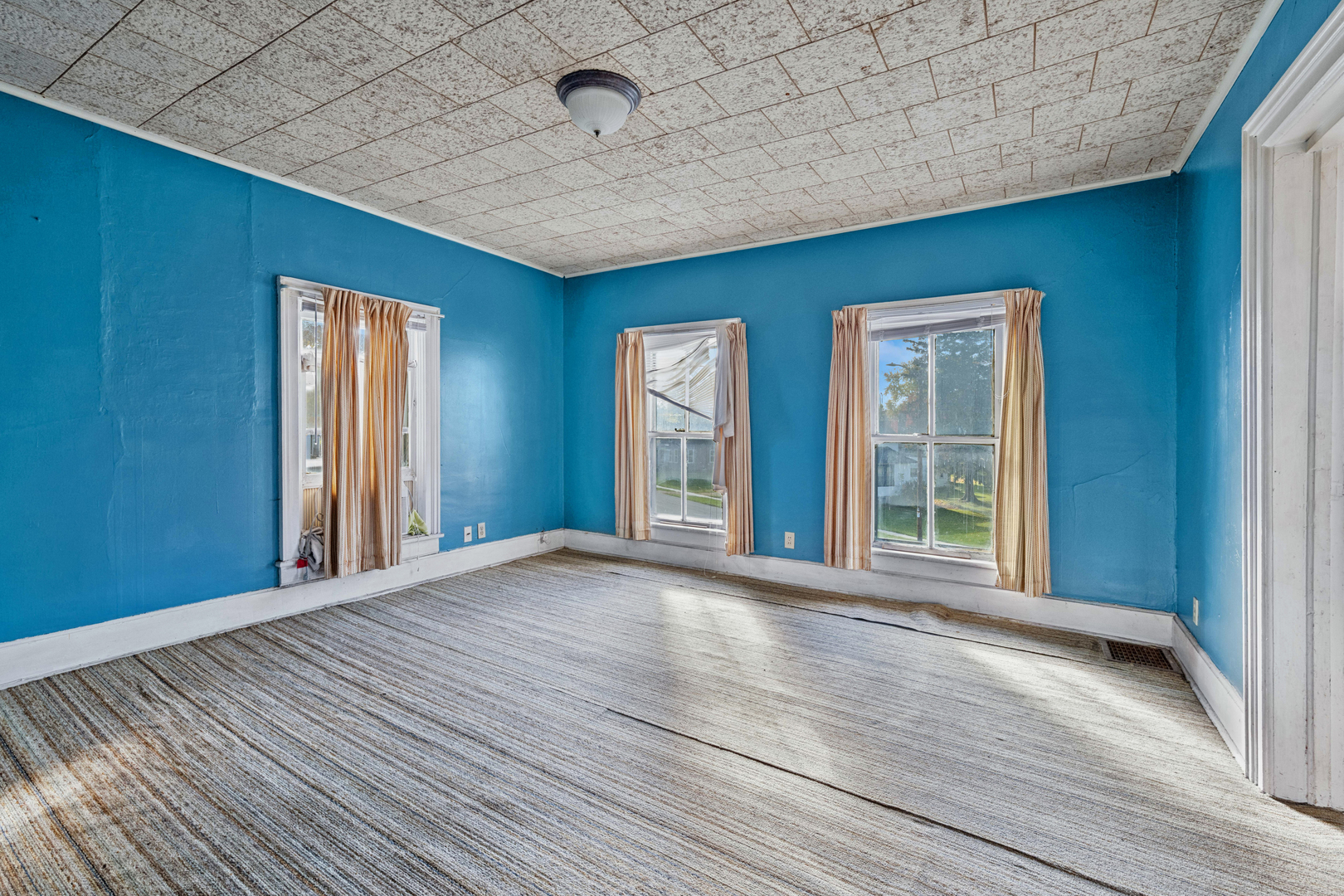 130 Seymour Street Sharon, WI 53585 - Photo 10 of 23 a view of an empty room with wooden floor and a window