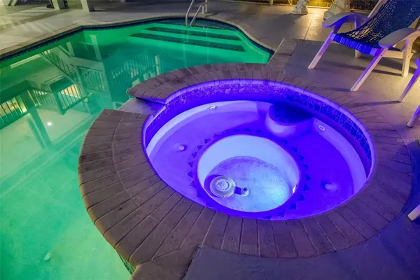 a living room with furniture and a piano