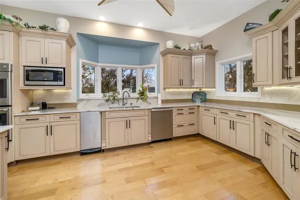 a bed room with a bed and a chandelier
