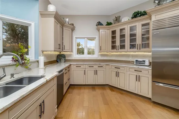 a spacious bedroom with a bed and a dresser