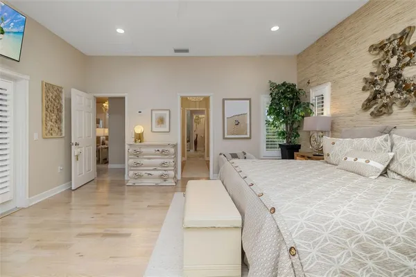 a bathroom with a granite countertop sink a toilet and shower