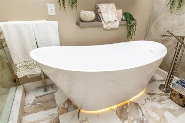 a bathroom with a toilet sink and shower