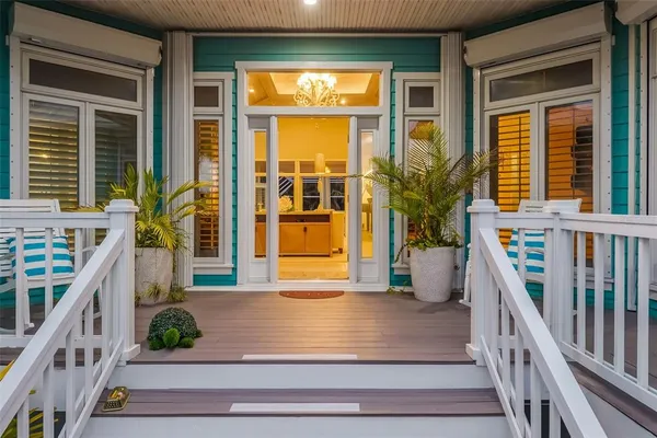 a view of a swimming pool with a porch in a patio