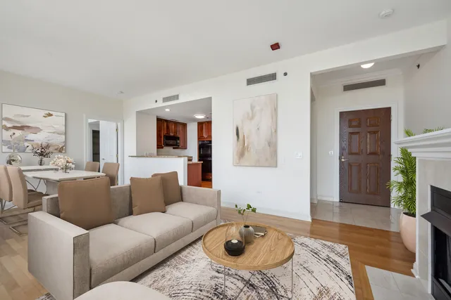 a living room with furniture couches and a fireplace