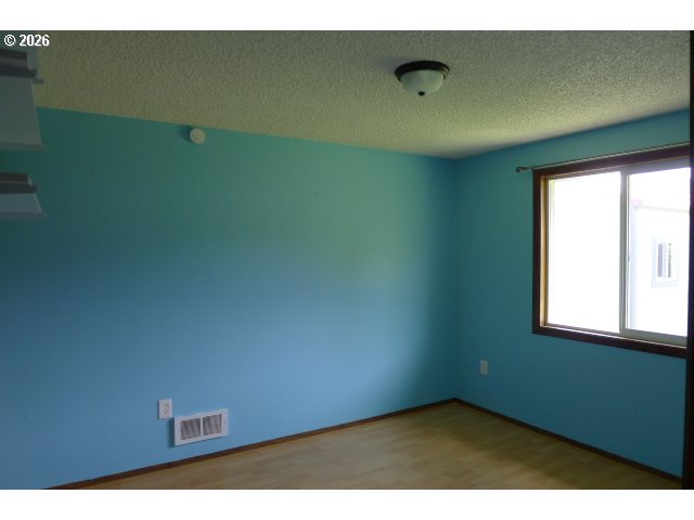 412 Camellia Court Reedsport, OR 97467 - Photo 31 of 48 a view of an empty room and window