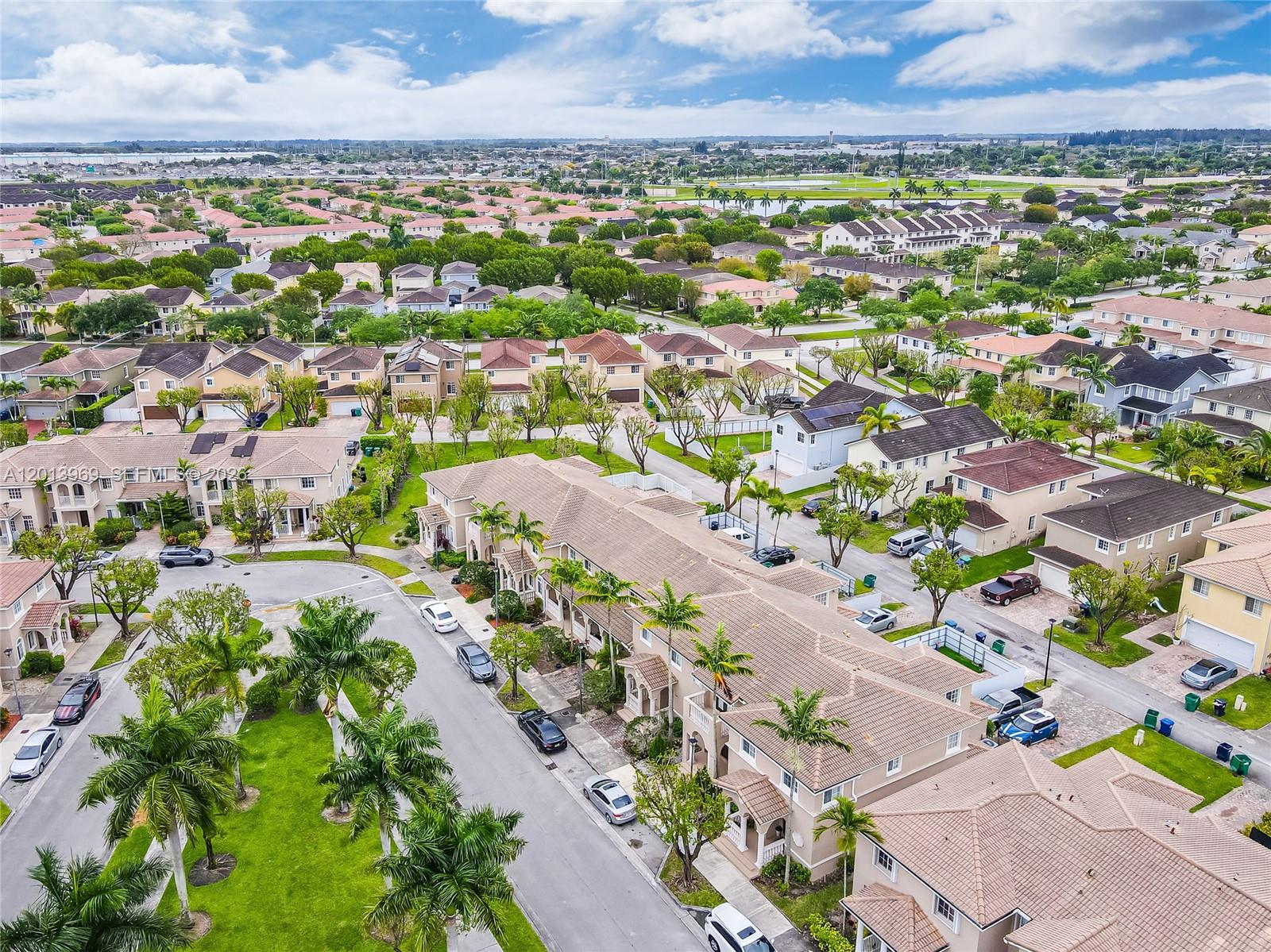 14044 Southwest 273rd Lane, Unit 14044 Homestead, FL 33032 - Photo 38 of 44 an aerial view of a city with lots of residential buildings