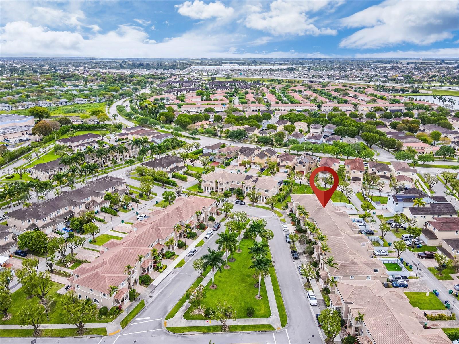 14044 Southwest 273rd Lane, Unit 14044 Homestead, FL 33032 - Photo 39 of 44 an aerial view of residential houses with outdoor space