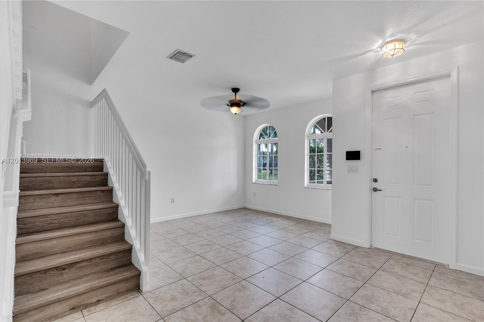 14044 Southwest 273rd Lane, Unit 14044 Homestead, FL 33032 - Photo 4 of 44 a view of entryway and hall with a window