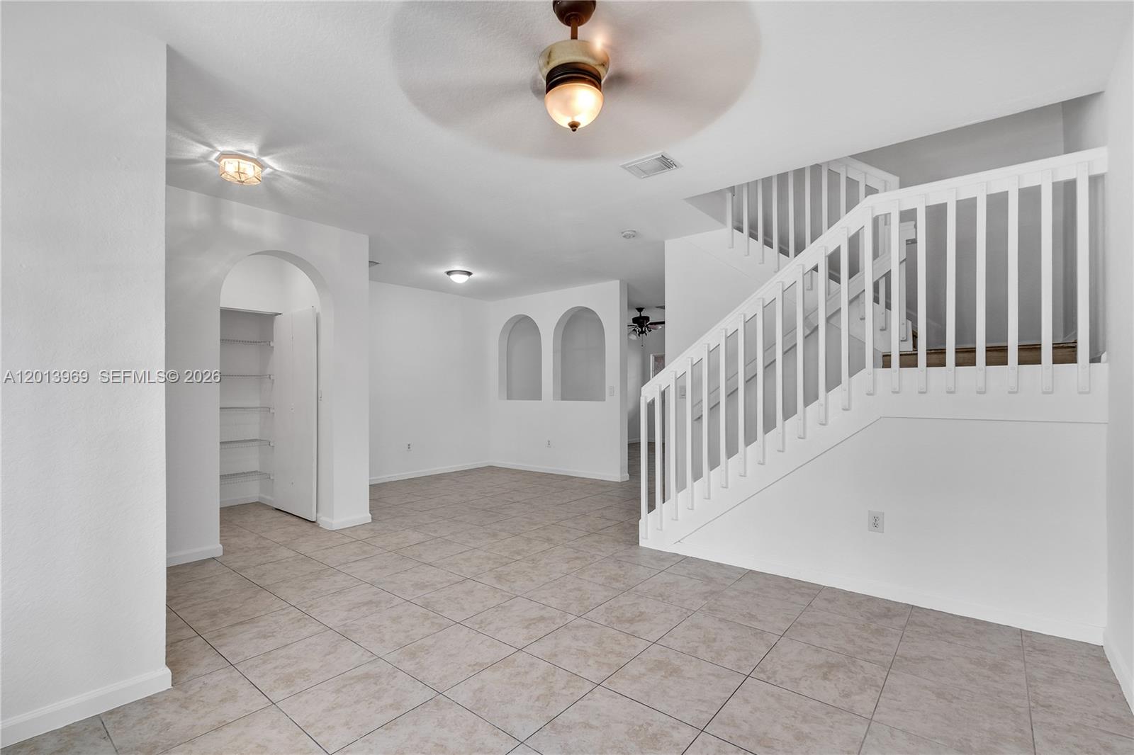 14044 Southwest 273rd Lane, Unit 14044 Homestead, FL 33032 - Photo 6 of 44 wooden floor in an empty room with a window