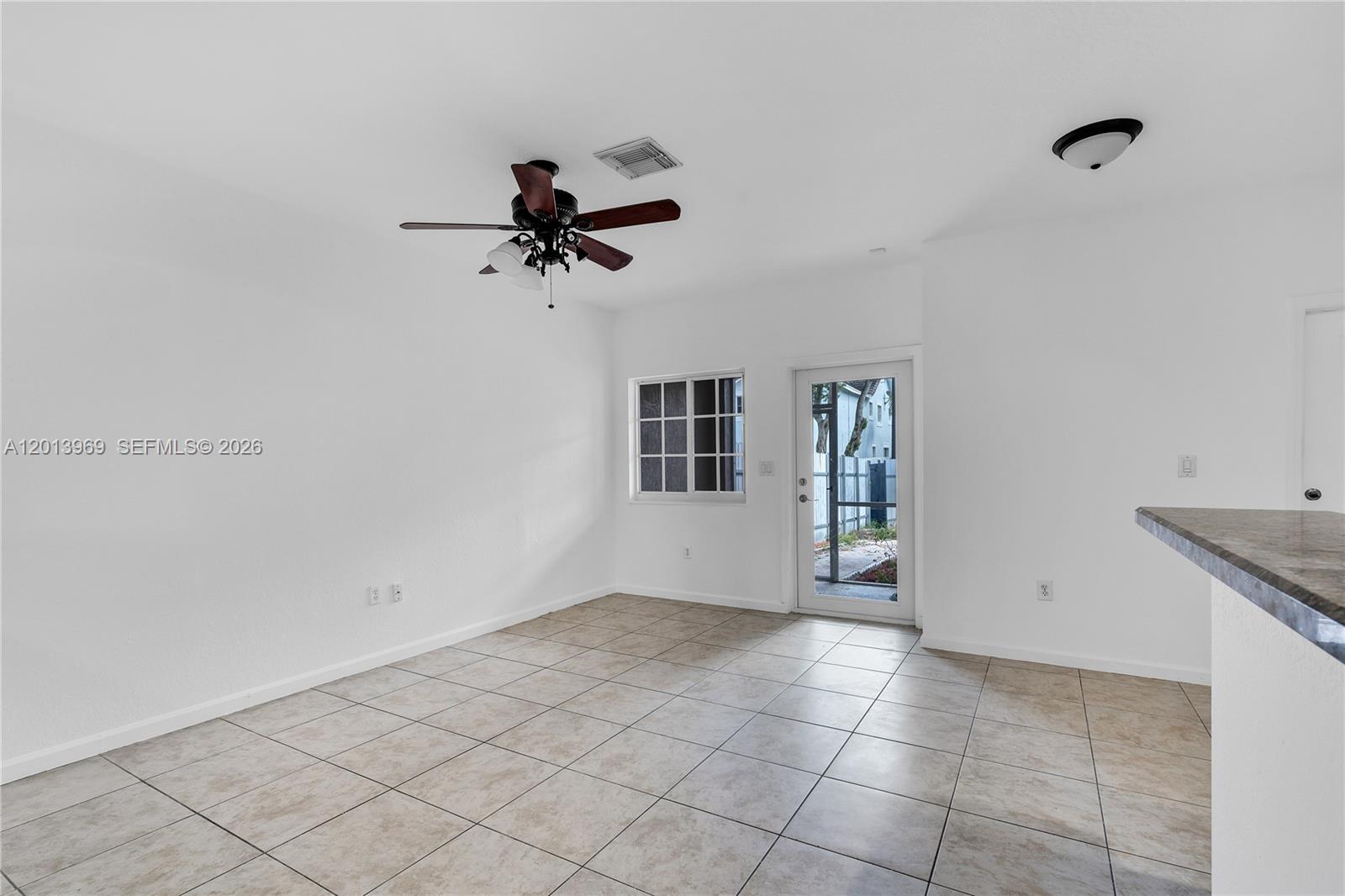 14044 Southwest 273rd Lane, Unit 14044 Homestead, FL 33032 - Photo 9 of 44 a view of an empty room