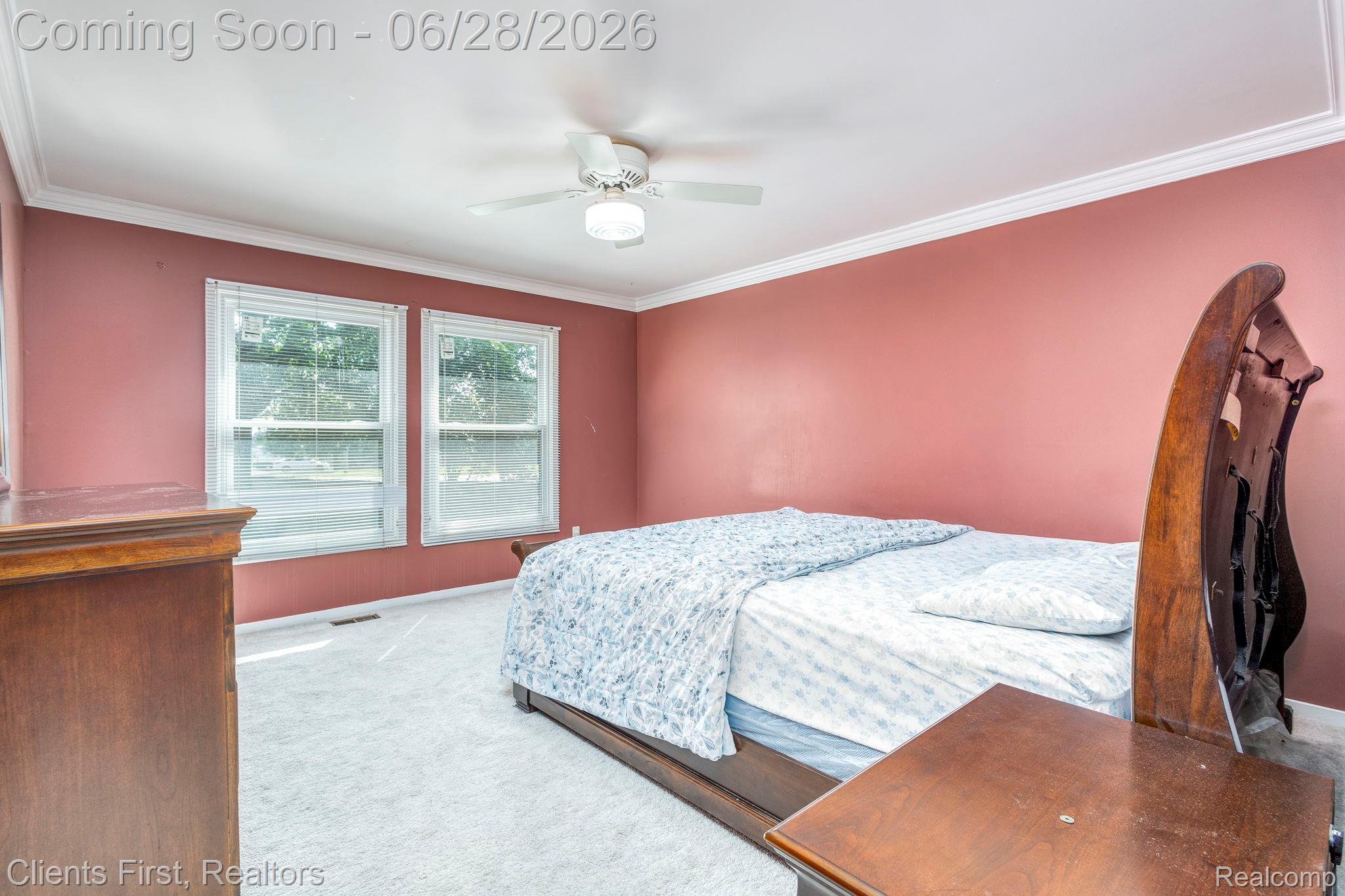 39478 Squire Road Novi, MI 48375 - Photo 15 of 24 Carpeted room featuring a ceiling fan with integrated lighting, crown molding, and two windows