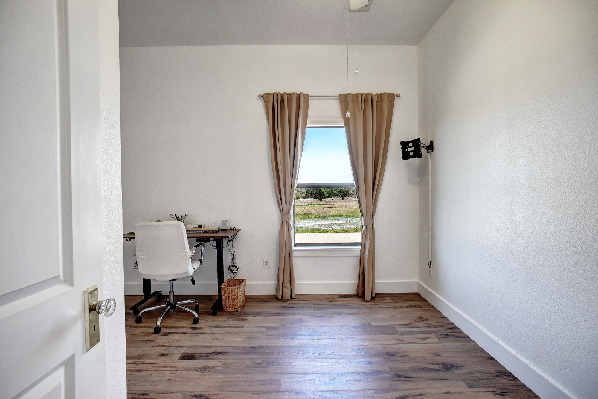 4165 Pin Oak Road Muldoon, TX 78949 - Photo 25 of 44 Home office featuring dark wood-type flooring and a textured wall