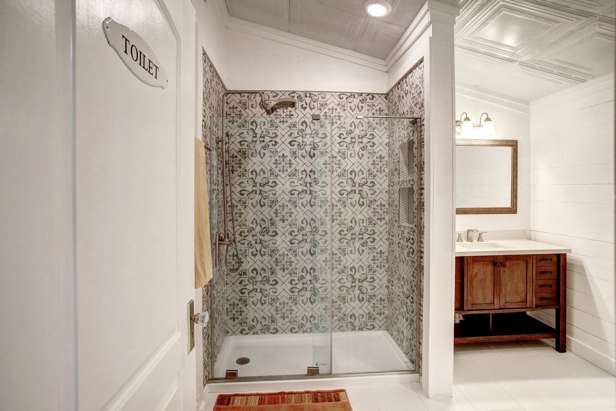 4165 Pin Oak Road Muldoon, TX 78949 - Photo 26 of 44 Full bathroom with a stall shower, vanity, ornamental molding, and light tile patterned floors