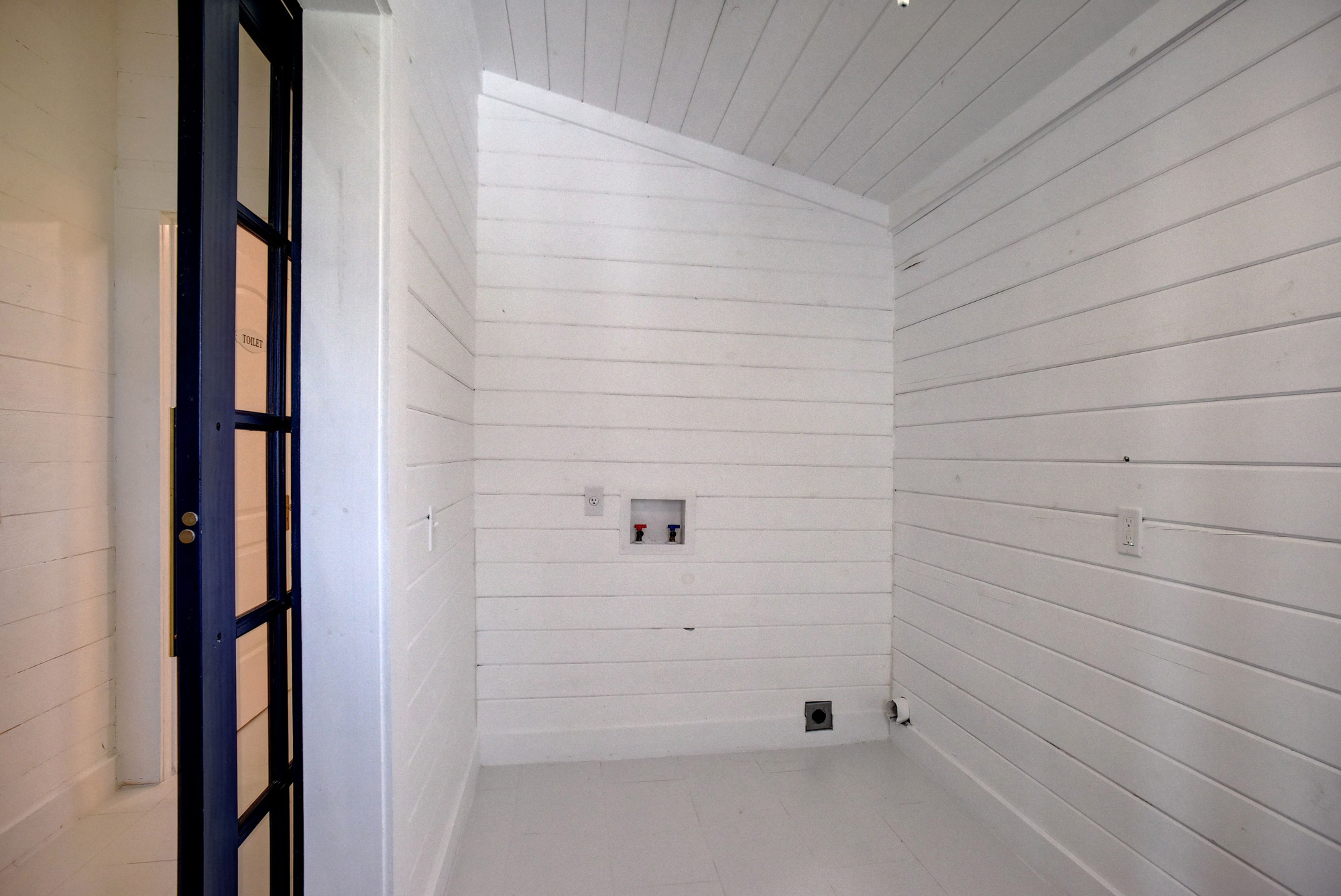 4165 Pin Oak Road Muldoon, TX 78949 - Photo 27 of 44 Laundry area featuring wooden walls, hookup for a washing machine, and a vaulted wooden ceiling