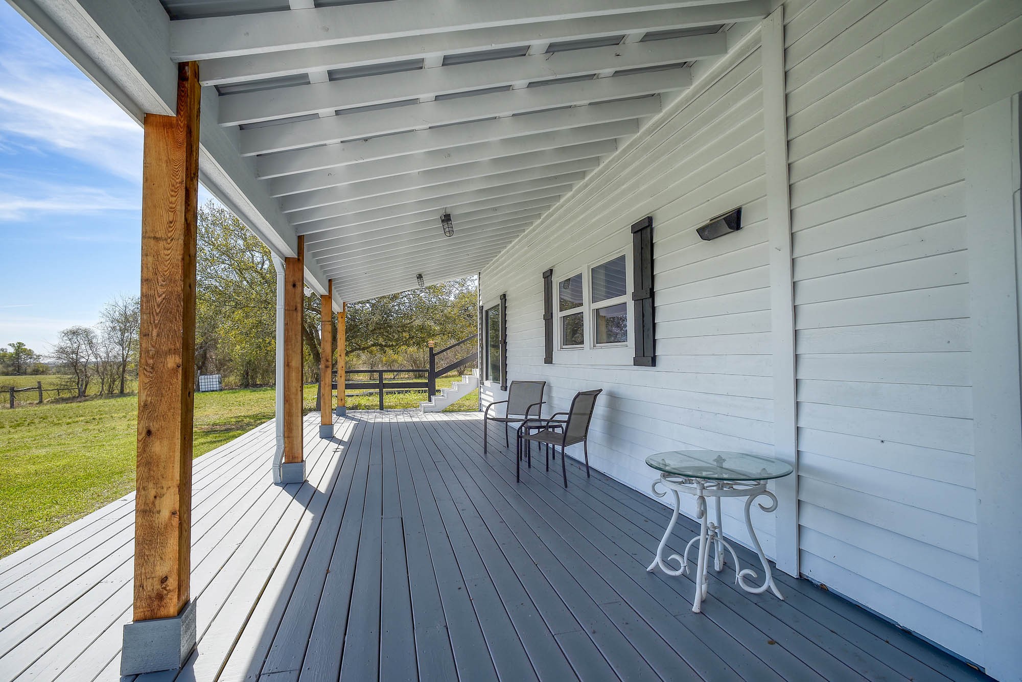 4165 Pin Oak Road Muldoon, TX 78949 - Photo 28 of 44 Wooden terrace with a lawn