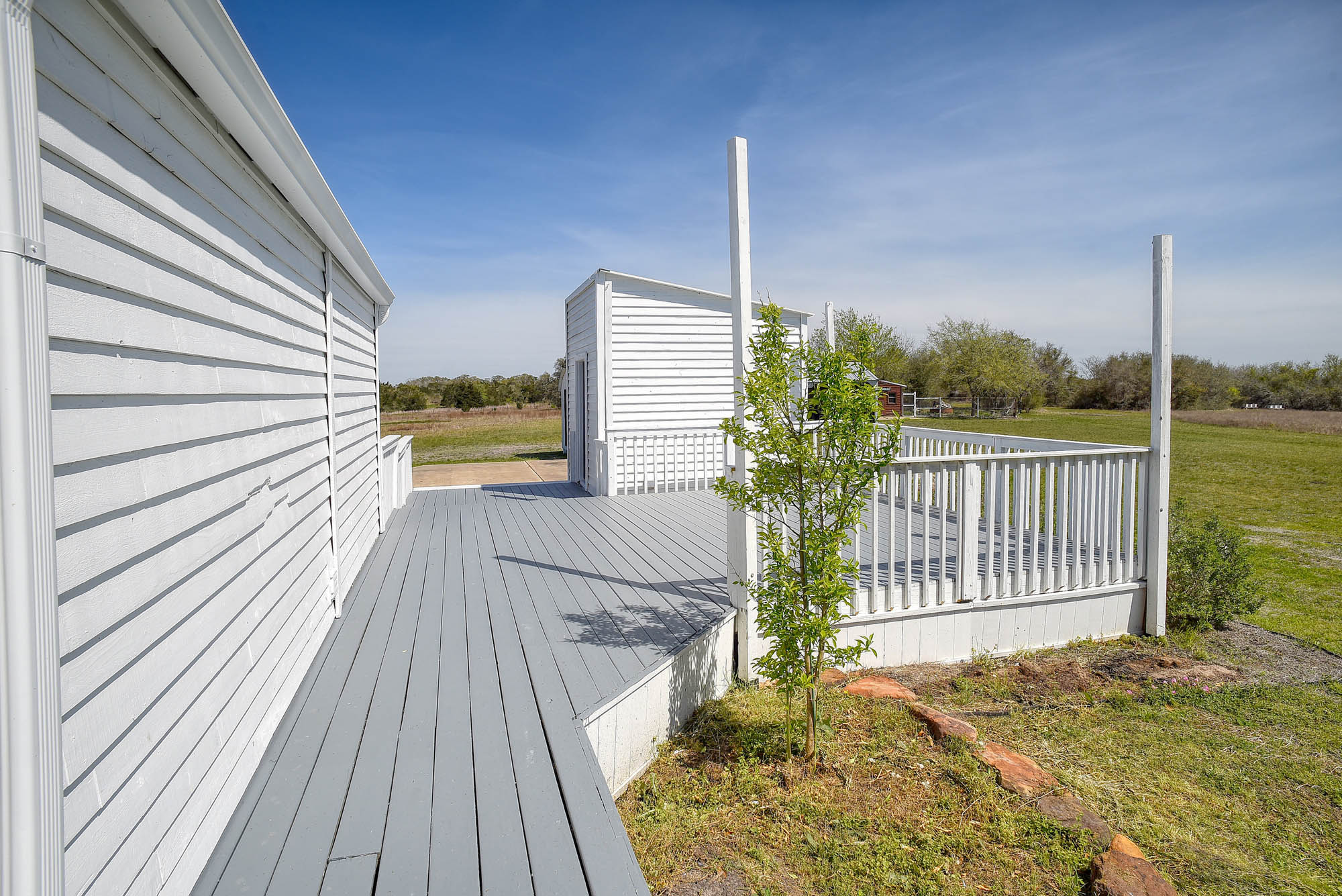 4165 Pin Oak Road Muldoon, TX 78949 - Photo 31 of 44 Deck featuring a lawn