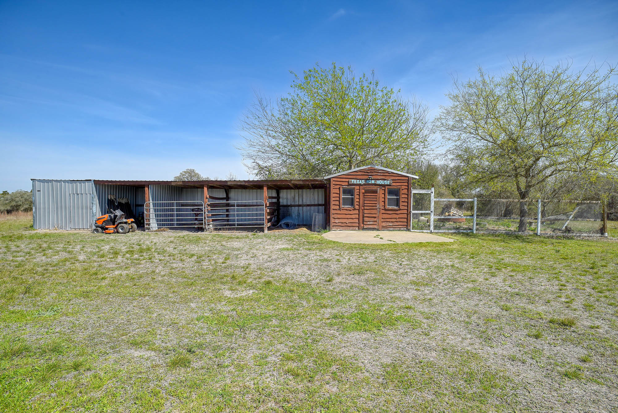 4165 Pin Oak Road Muldoon, TX 78949 - Photo 33 of 43 a front view of a house with a garden