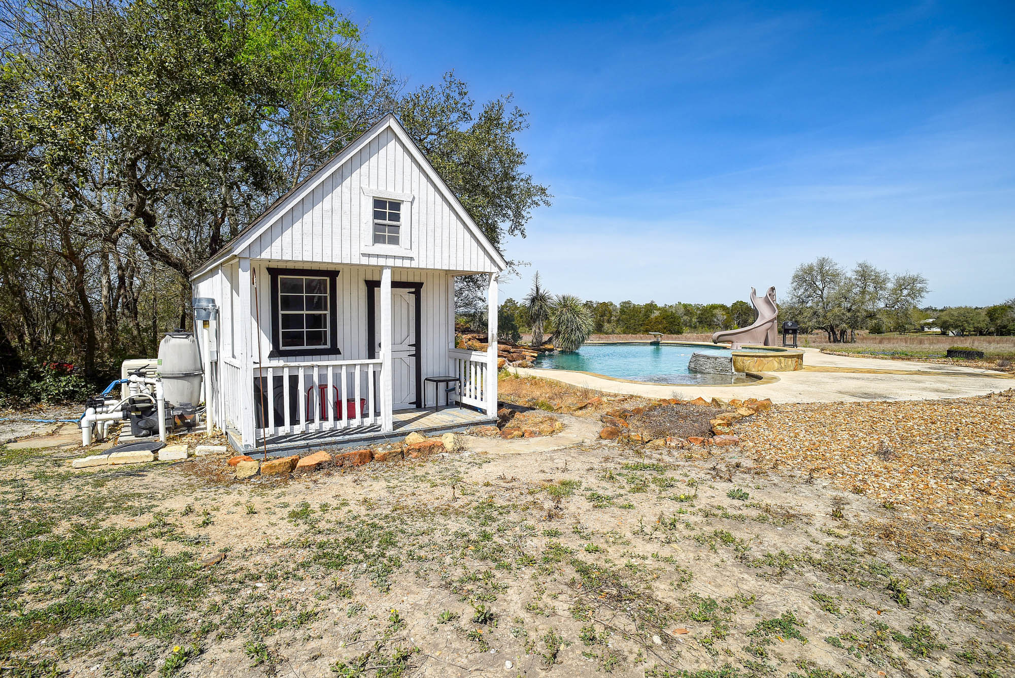 4165 Pin Oak Road Muldoon, TX 78949 - Photo 37 of 43 a view of a house with backyard and deck