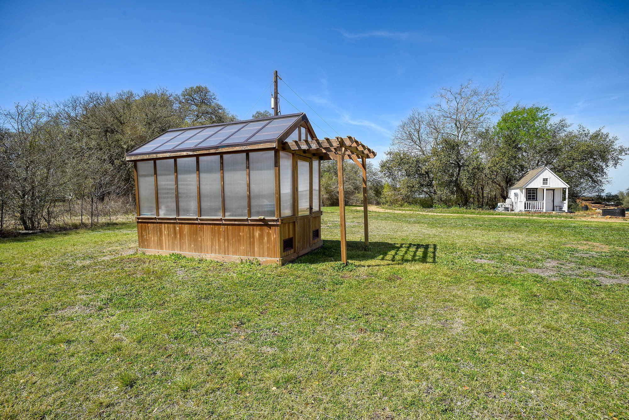 4165 Pin Oak Road Muldoon, TX 78949 - Photo 39 of 43 a view of a house with a yard