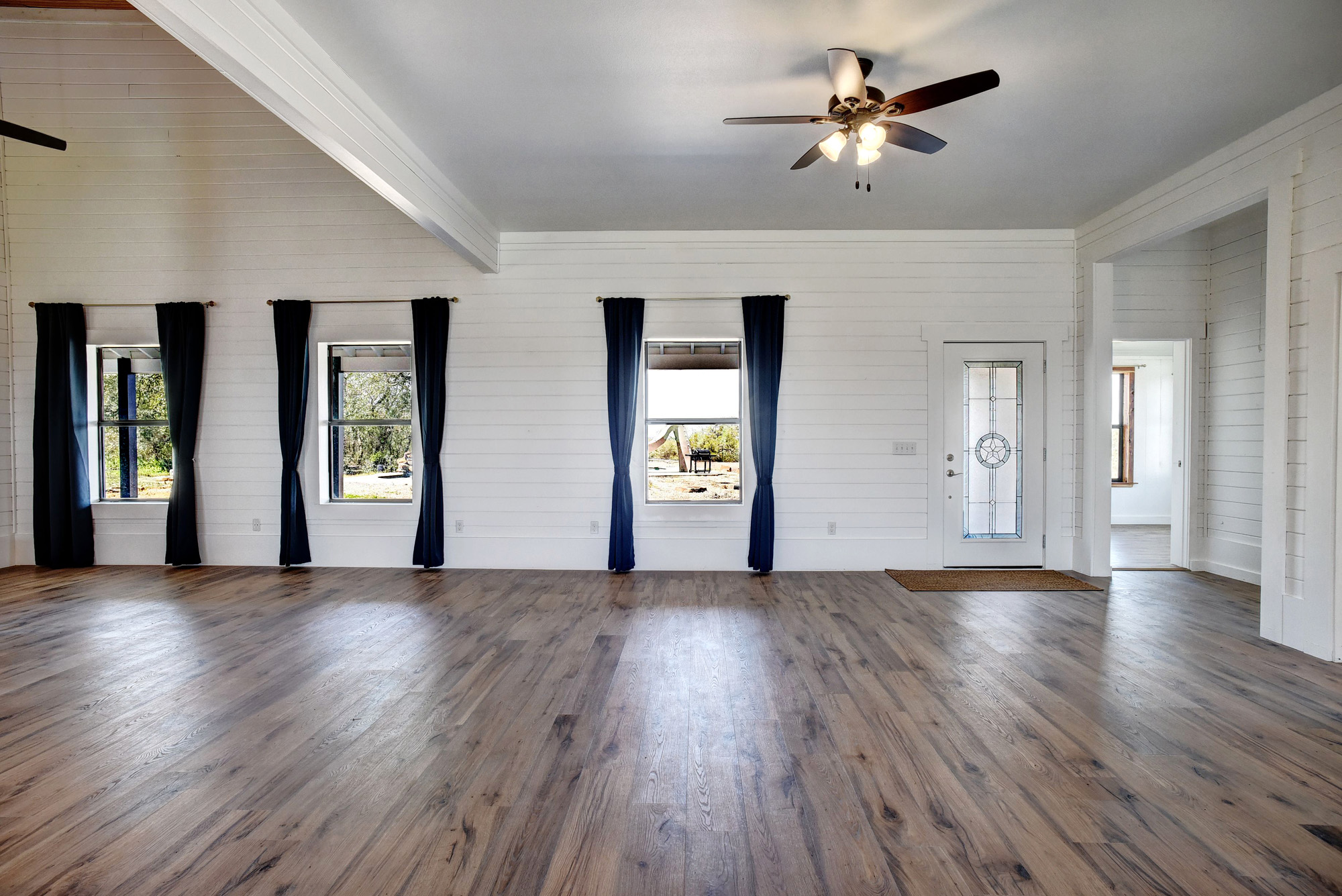 4165 Pin Oak Road Muldoon, TX 78949 - Photo 5 of 44 Entrance foyer featuring ceiling fan, dark wood-type flooring, and healthy amount of natural light